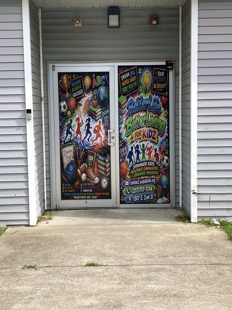 Full-color printed decals installed across a storefront's glass door